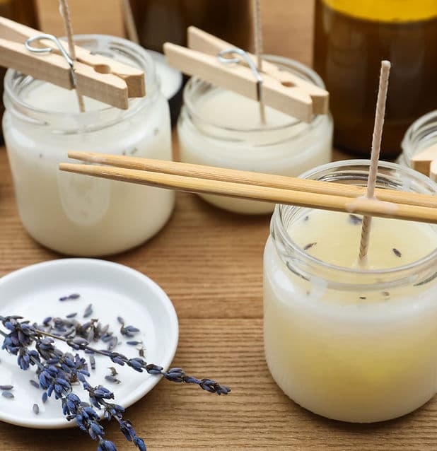 Hand-poured candle making supplies arranged for a creative workshop