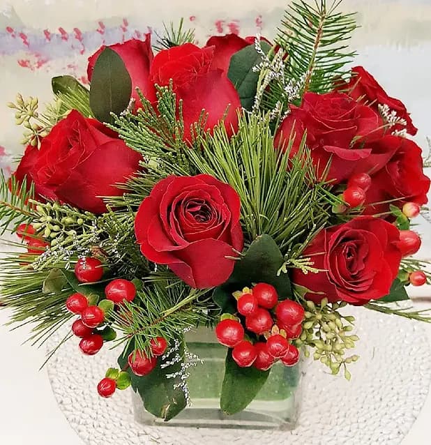 Seasonal flowers and foliage arranged into a colorful centerpiece