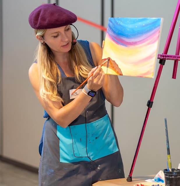 Guests creating guided paintings at an A Sip of Color event