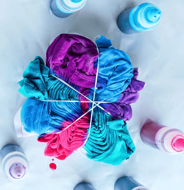 Bright tie-dye textile with folded and bound color patterns